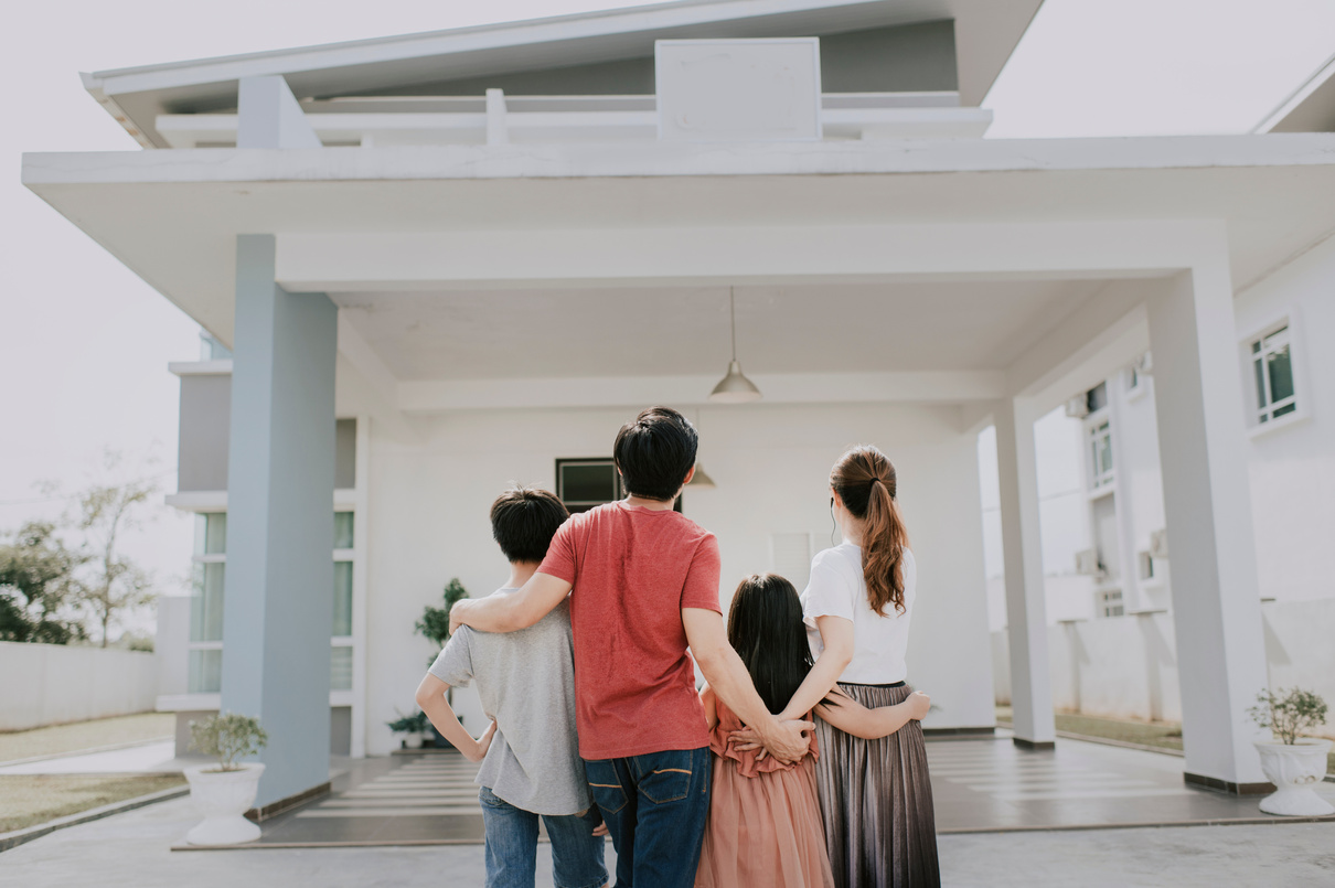 an asian chinese family moving into new house admiring their house